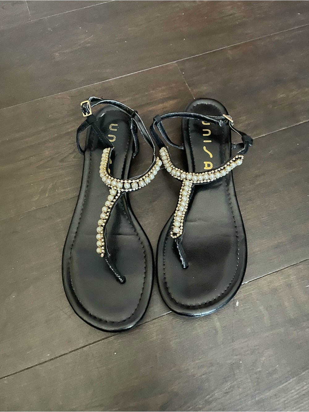 Unisa Black T-Strap Sandals with Gold Bead Embellishment